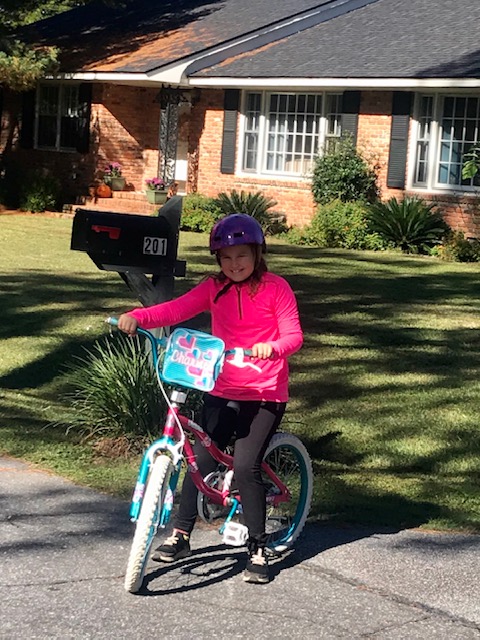 Little girl riding bike